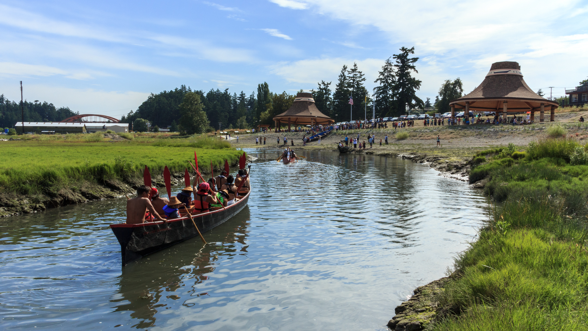 Native Canoe being paddled.