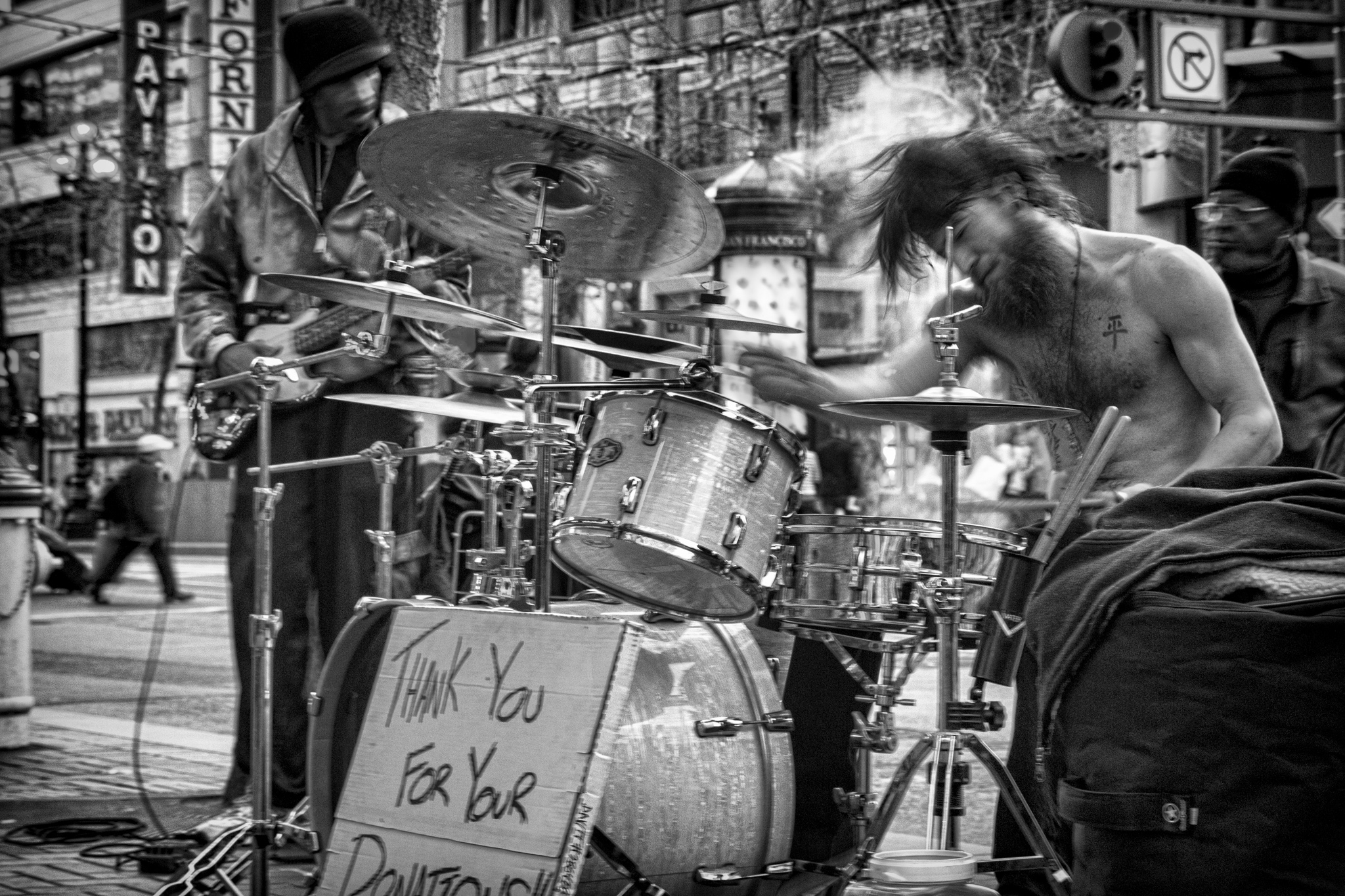 Black and white of street musicians and active drummer