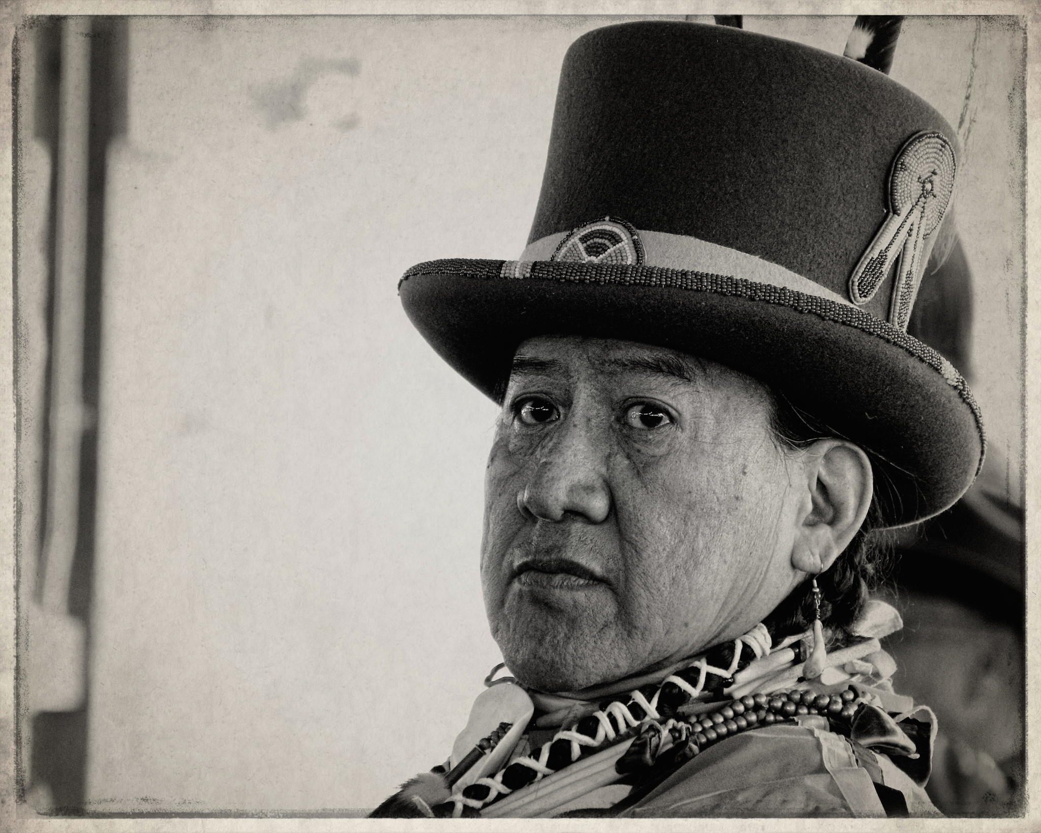 Native elder in traditional clothing.