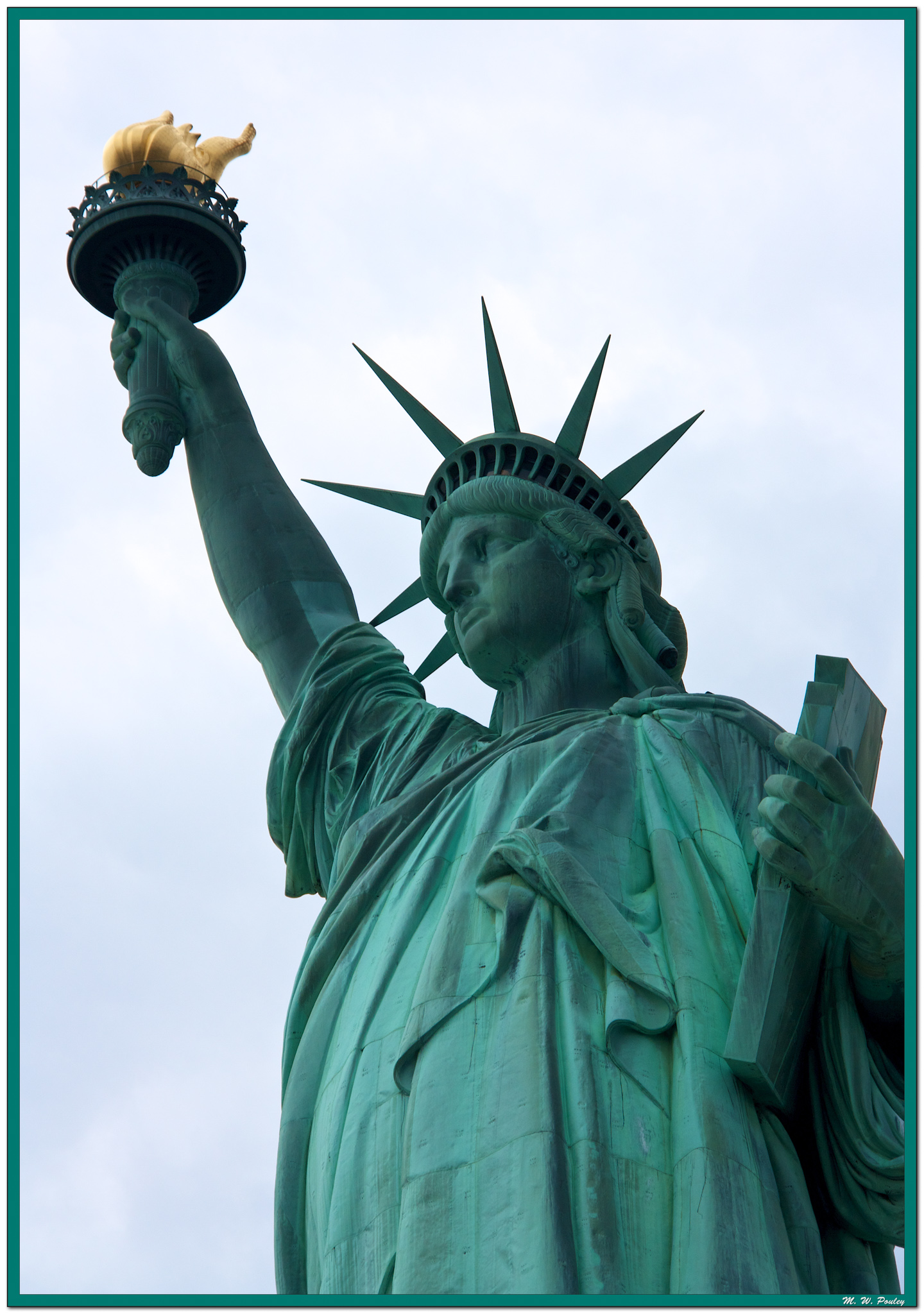 Statute of Liberty reaching skyward.